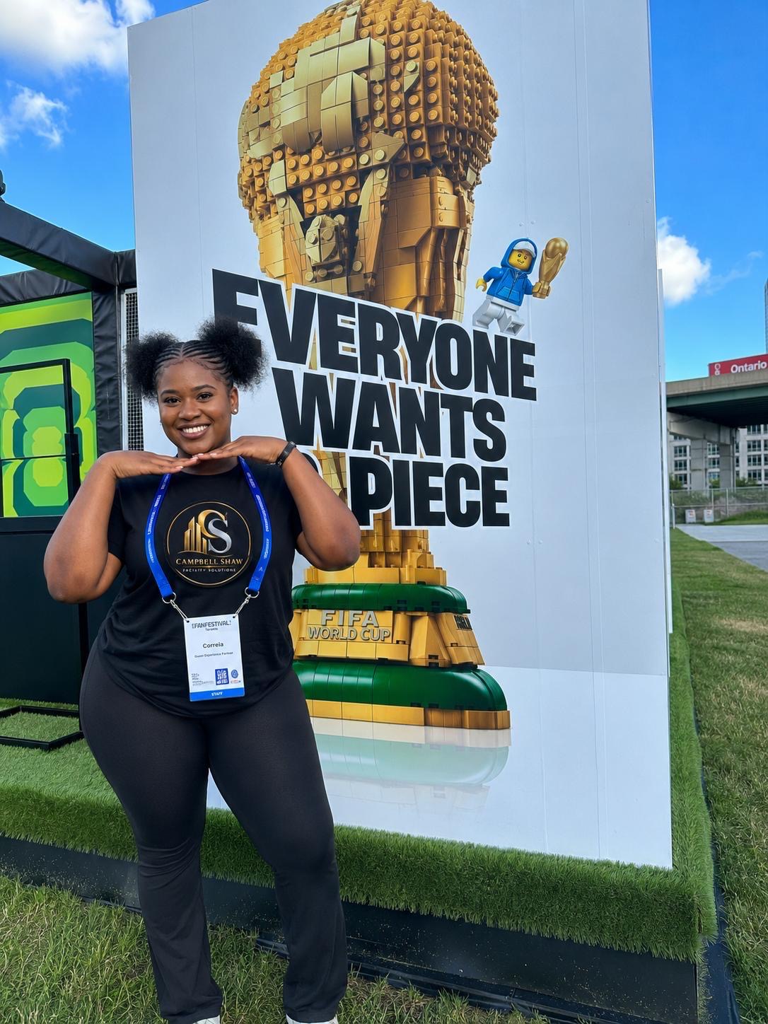 Campbell Shaw team member in a branded shirt with an event staff pass on site at the FIFA Fan Festival in Toronto